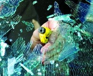 RESQME - Car escape tool smashing a car window